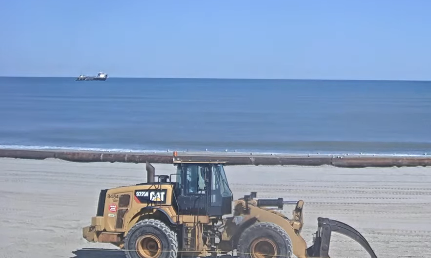 Following two weeks of rough seas, beach nourishment resumes along Outer Baks