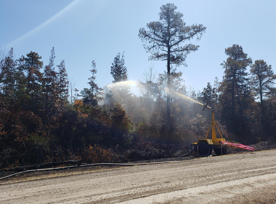 Despite windy weekend, fire crews maintain containment of wildfire west of Outer Banks